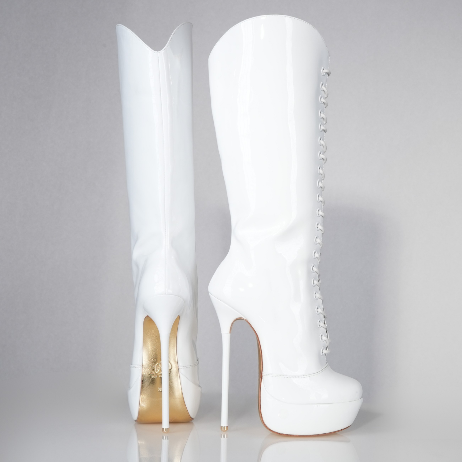 Mistress white patent high heel knee-boots with 160mm Superarch high heels, profile view.