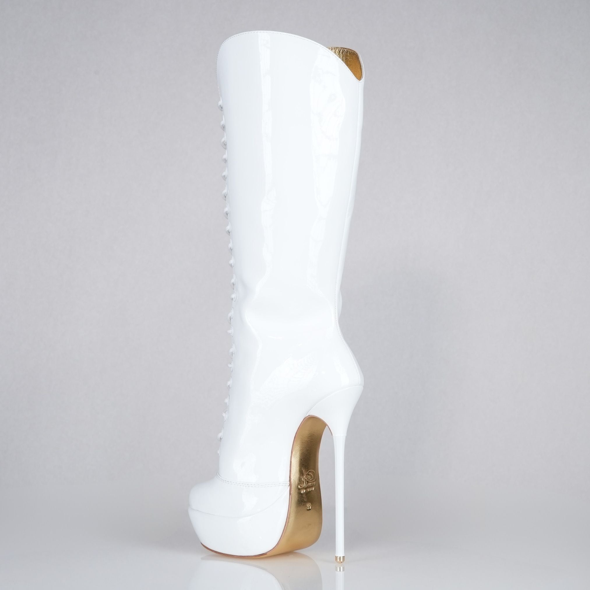White patent 160mm stiletto high heel knee boots, round metal tips, extreme 90 degree superarch, Mistress Collection, closeup view.