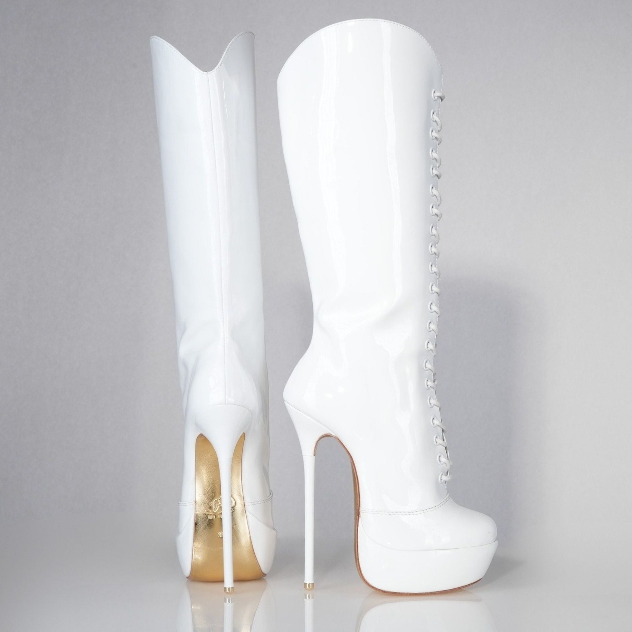 White patent 160mm stiletto high heel knee boots, round metal tips, extreme 90 degree superarch, Mistress Collection, profile view.